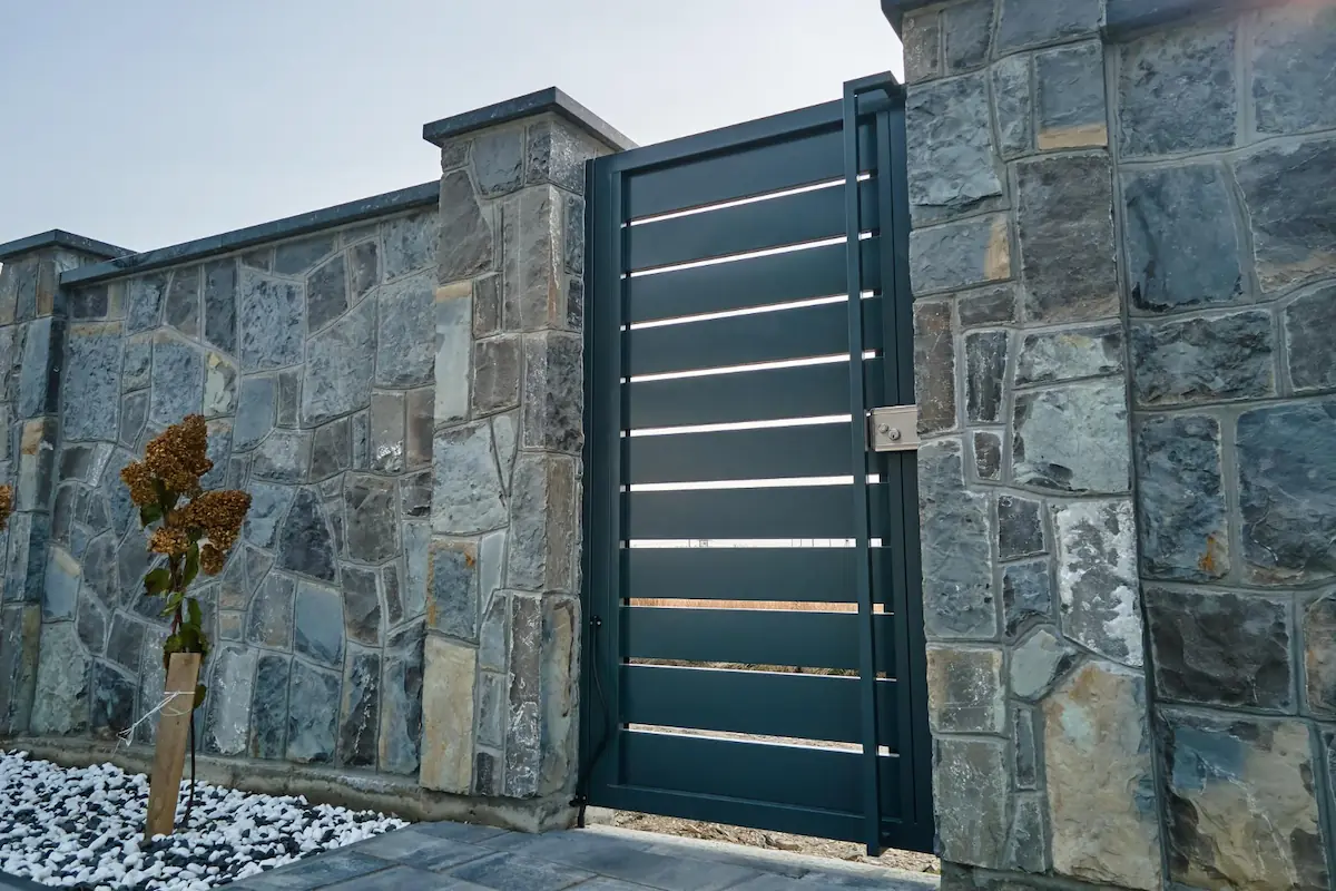 Stone-Textured Concrete Fence
